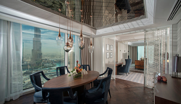 Retro Lights and Flora Pendants by Rothschild & Bickers over dining area in the Taj Downtown Dubai