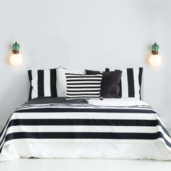 Stripe green and opal white glass beside wall sconce