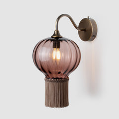 Opulent Optic wall light with hand-blown glass shade and Antique brass wall fitting