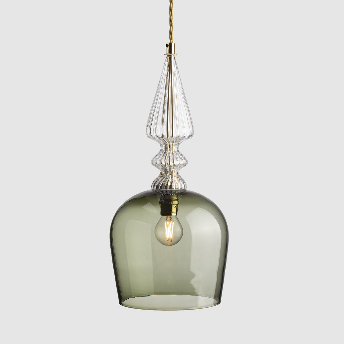 Smoky glass pendant light with gold accents on a white background