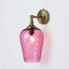 Decorative wall light with hand-blown twisted glass shade and antique brass fixture
