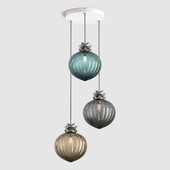 Group of Teal, Grey and bronze coloured pendant lights in ribbed glass and decorative floral metalwork hanging on a ceiling plate
