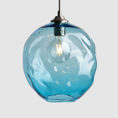 Copper organic shaped clear glass suspension pendant lights with brushed nickel fittings and fabric covered flex