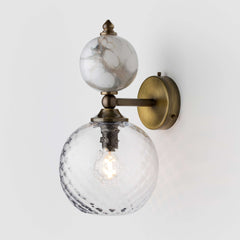 Clear glass and marble wall light.