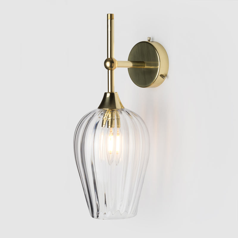 Coloured optic pattern blown glass ball  light shade on a polished brass wall arm