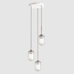 Group of clear ribbed glass nautical style decorative pendant lights hanging on a ceiling plate