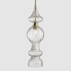 Spindle shaped clear ribbed glass pendant light with fabric covered twisted flex