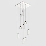 Large square ceiling plate for hanging multiple pendant lights in stairwell or foyer entrance.