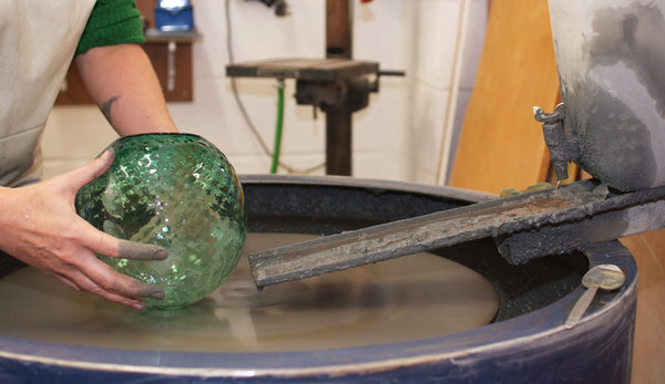 Grinding glass shade at Rothschild & Bickers workshop