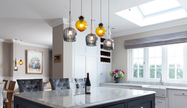 Spindle Shade and Flora Standard pendants by Rothschild & Bickers hanging over kitchen island by Jonathan Williams 