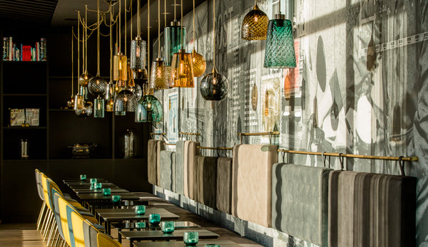 Rothschild & Bickers Pick-n-Mix pendants hung in a large cluster at Motel One Leipzig Post