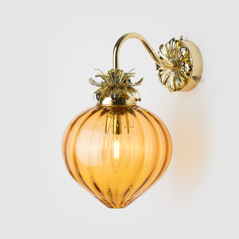 Polished Brass Floral wall sconce with ribbed amber glass shade