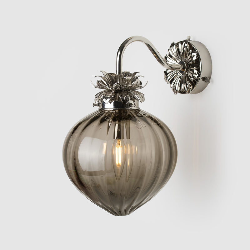 Polished Nickel Floral wall sconce with fluted smoke glass shade