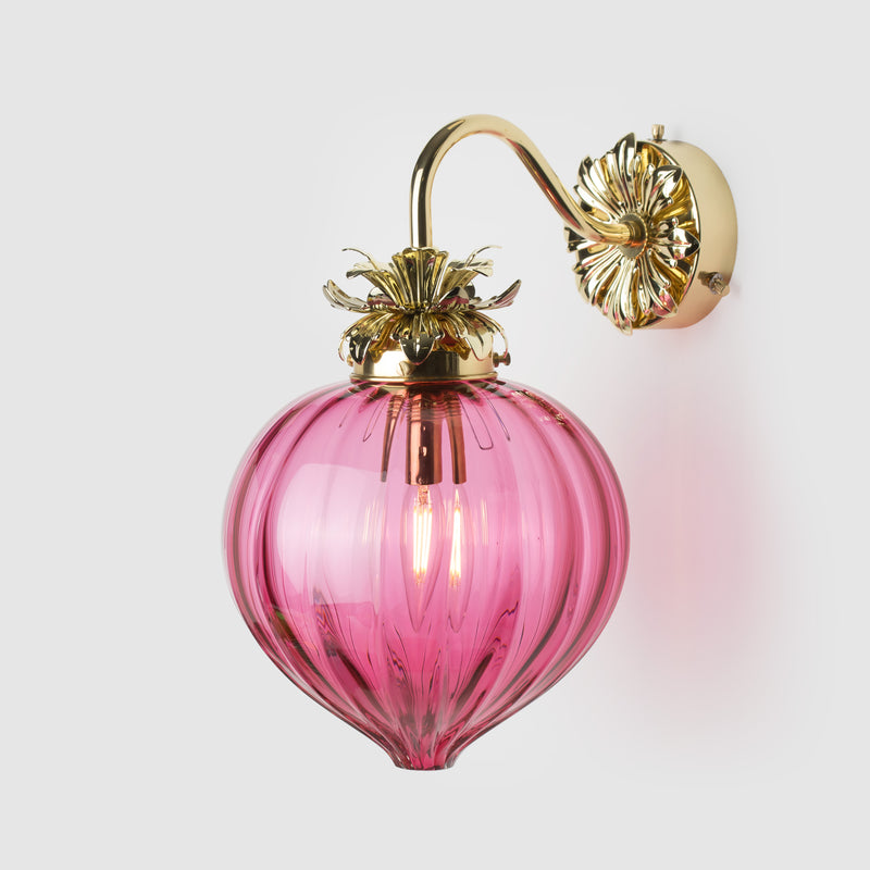 Floral brass wall sconce with blown ruby glass bud shape