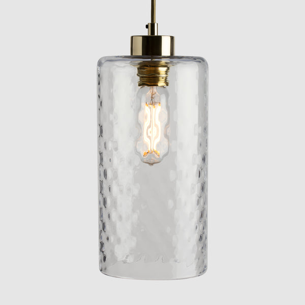 Clear diamond glass cylinder pendant light with brass fittings and fabric covered flex