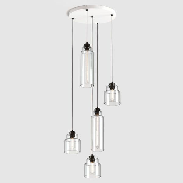 Group of Stepped clear glass decorative pendant lights with polished zinc fittings and fabric covered flex, hanging on ceiling plate
