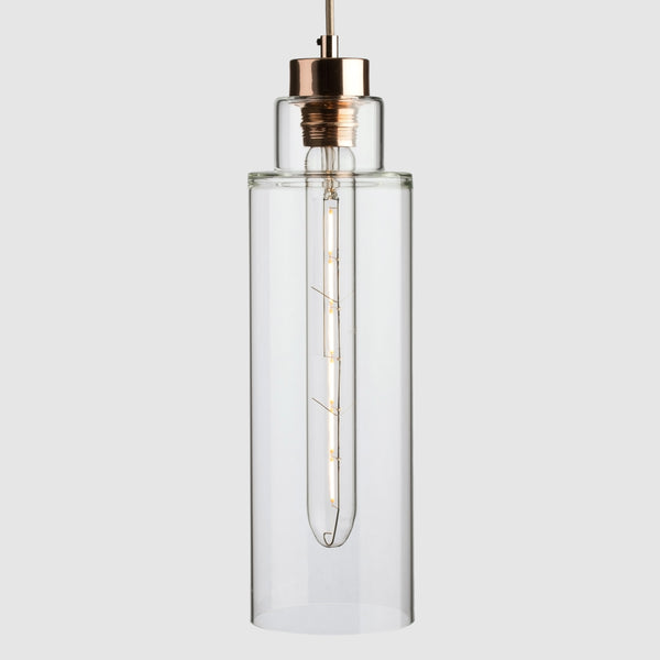 Tall Stepped clear glass decorative pendant light with copper fittings and fabric covered flex