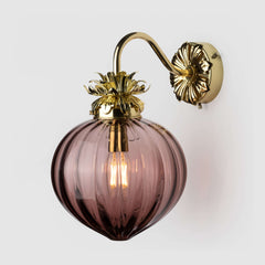 Tea brown coloured wall light with ribbed glass shade and decorative brass metalwork fitting