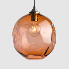 Peach organic shaped clear glass suspension pendant lights with brushed nickel fittings and fabric covered flex