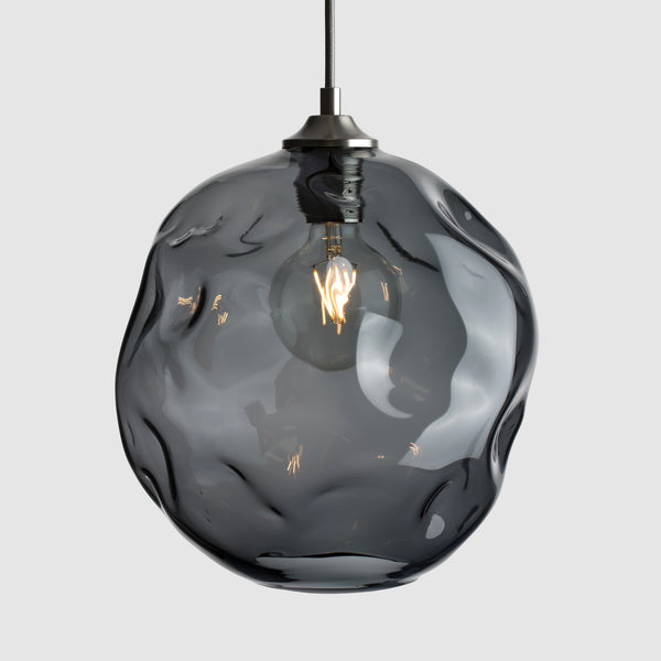 grey organic shaped clear glass suspension pendant lights with brushed nickel fittings and fabric covered flex