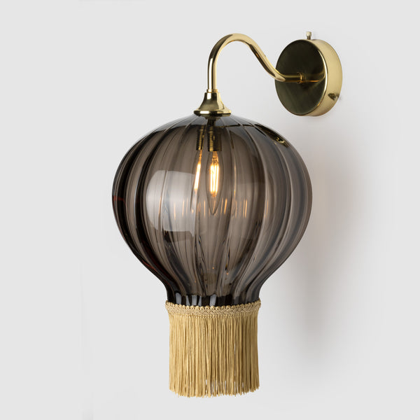 Glass wall lamp with fringe