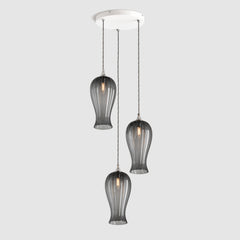 Group of Long ribbed grey coloured glass decorative pendant lights with brass fitting and fabric covered flex, hanging on a ceiling plate
