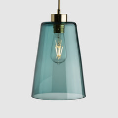 Steel pot shaped pendant light in clear glass with brass fittings and fabric covered flex