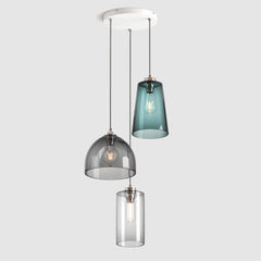 Blue, grey and clear blown glass pendant lights on a ceiling plate with silver colour fittings and fabric covered flex