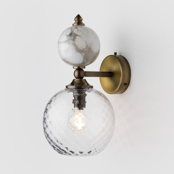 Clear glass and marble wall light.