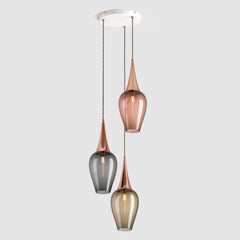 Group of clear glass pendant lights in tea, grey and bronze colours hanging on a ceiling plate
