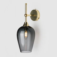 Coloured blown glass ball  light shade on a polished brass wall arm