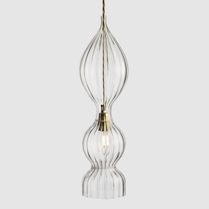 Spindle shaped clear ribbed glass pendant light with fabric covered twisted flex