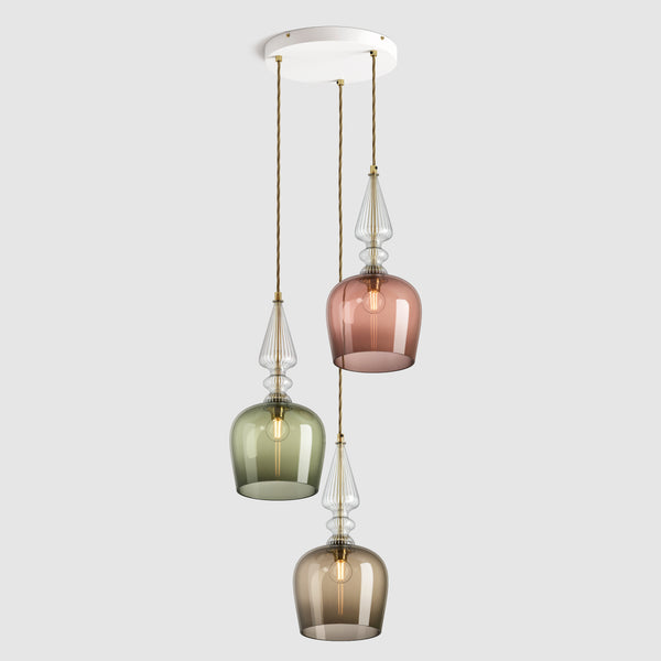 Group of Tall cloche shaped glass pendant lights in tea, eel and bronze with decorative clear ribbed glass spindle feature, hanging on ceiling plate with fabric covered flex