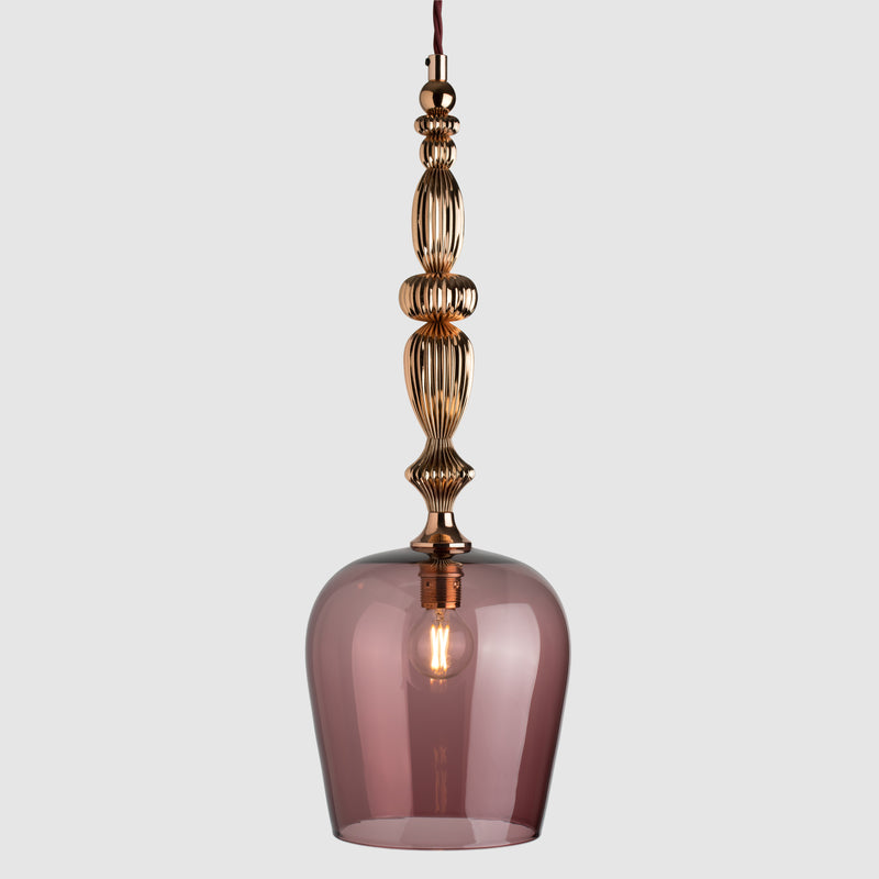 Tea coloured glass pendant light with decorative polished copper metal detail and fabric covered flex