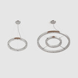Metallic chrome finish suspension rings for hanging multiple pendant lights over a stairwell or in foyer entrance