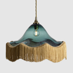 Teal coloured frilled glass decorative pendant light with fabric lamp fringe and twisted flex